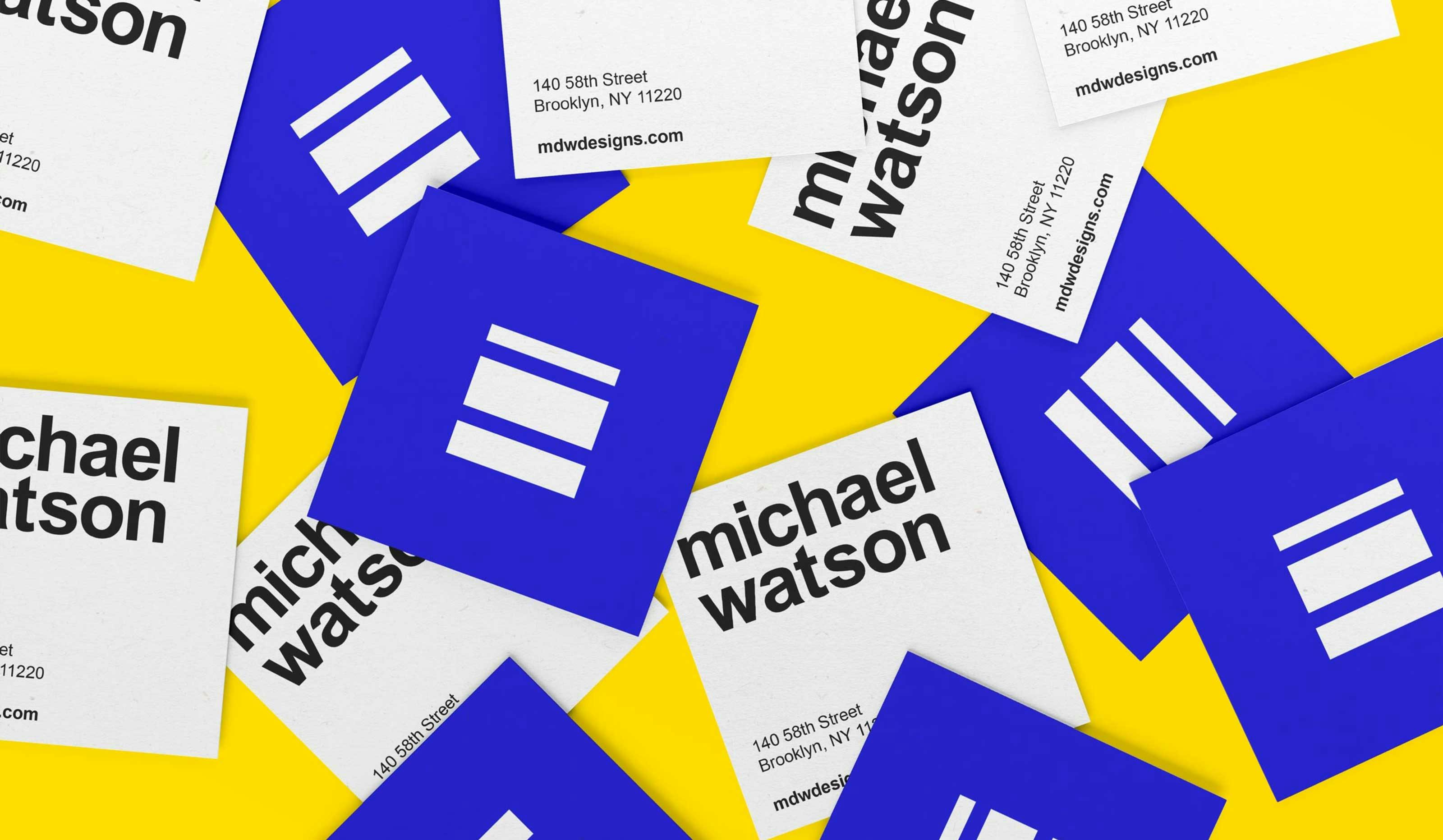 Business-cards-scattered-showing-fine-artist-logo-in-blue-and-yellow-colors-based-in-New-York-City.jpg